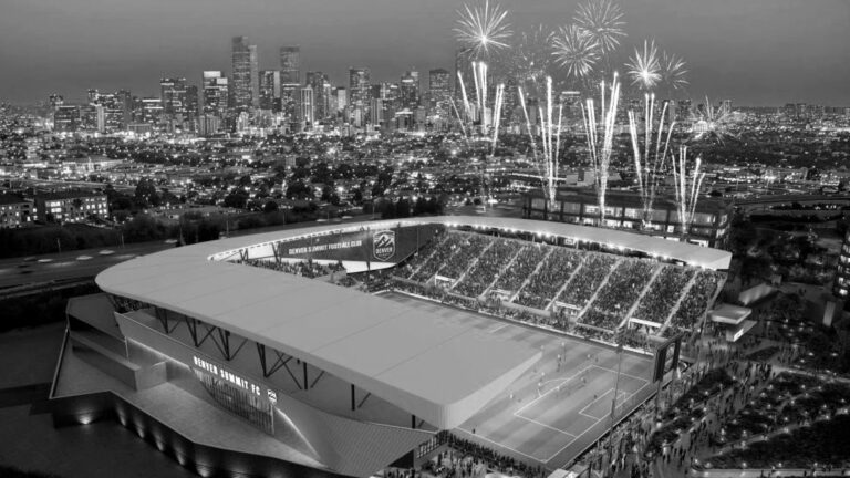 Black and White Photo of Stadium with Fireworks